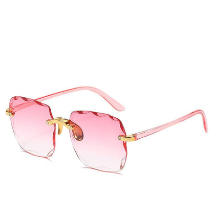 Trendiga randlösa solglasögon med UV400-skydd i vintage-look – Clea
